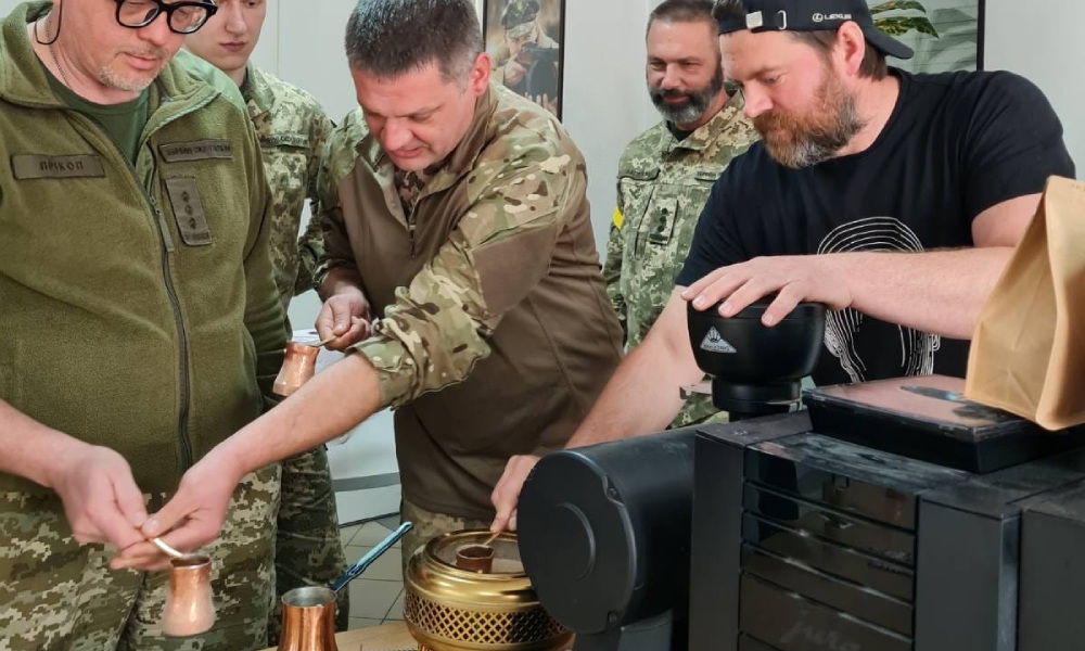 Vadym Granovskiy shows ukrainian military officers how to use a cezve