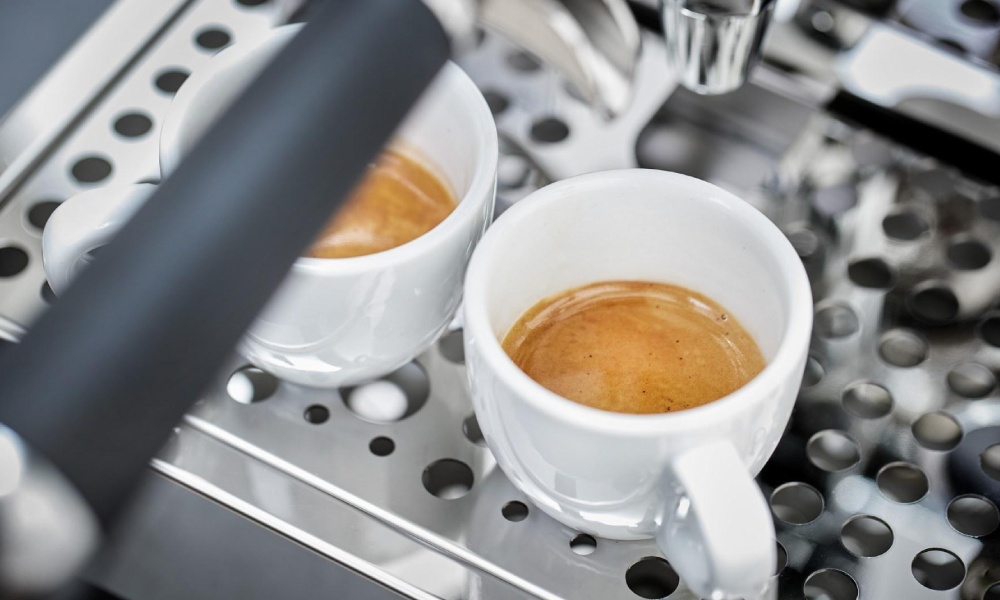 cups of espresso on a dual boiler coffee machine